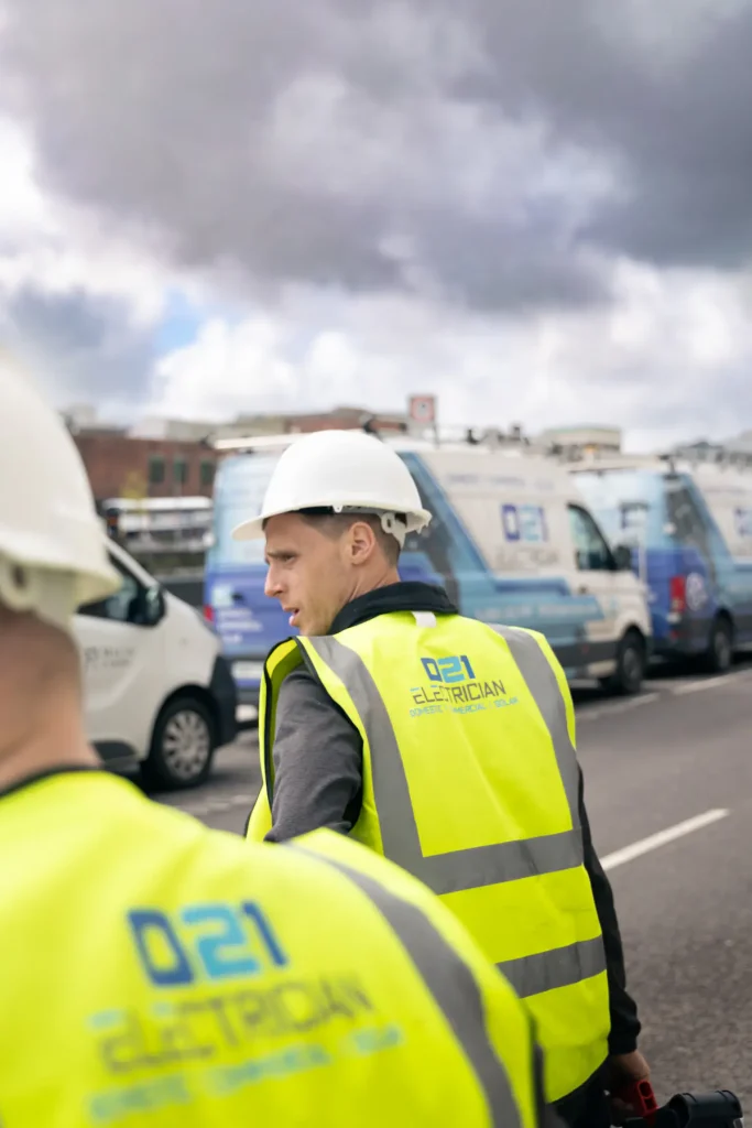 021 Electrician team members arriving at a commercial job site in Cork.