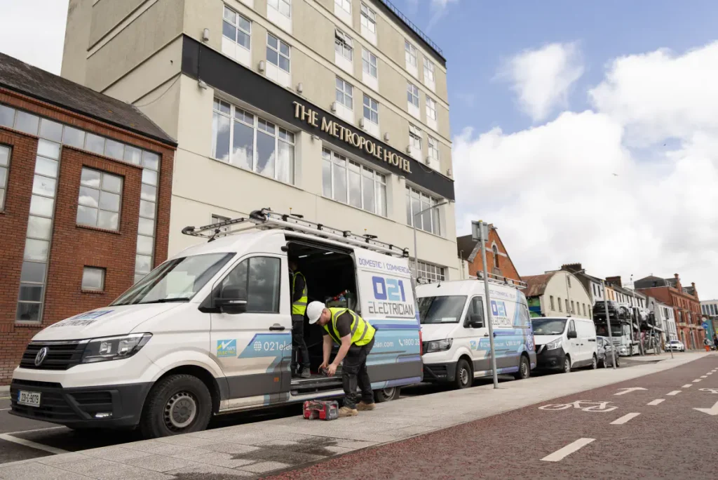 021 Electrician vans parked outside The Metropole Hotel Cork for commercial electrical work.